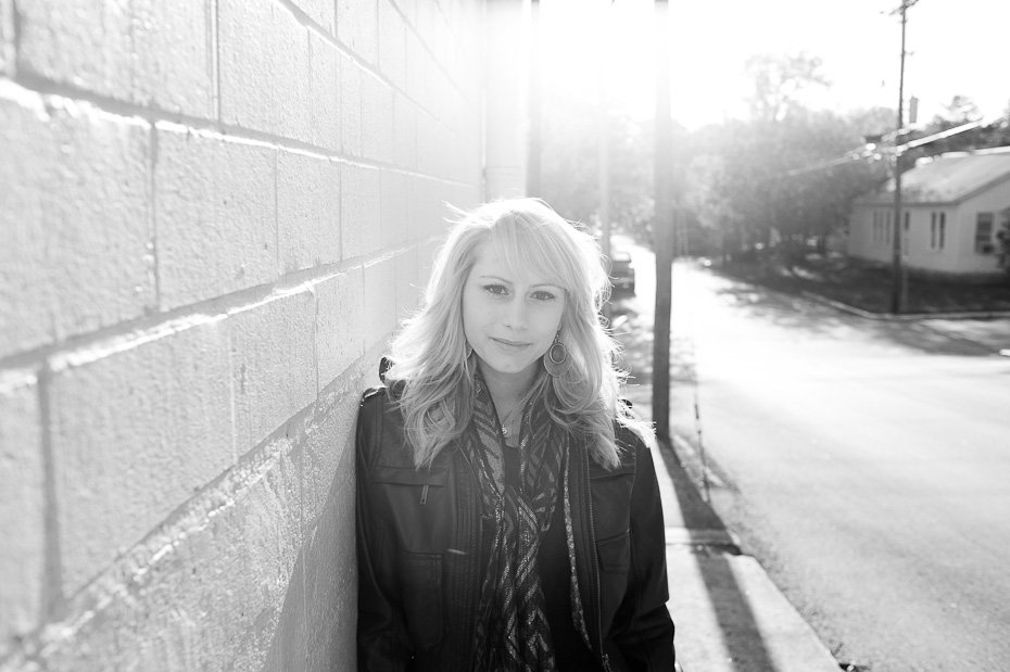 black and white girl smiling at camera, graduation portraits of blonde girl, texas state senior photographs, girl portriats
