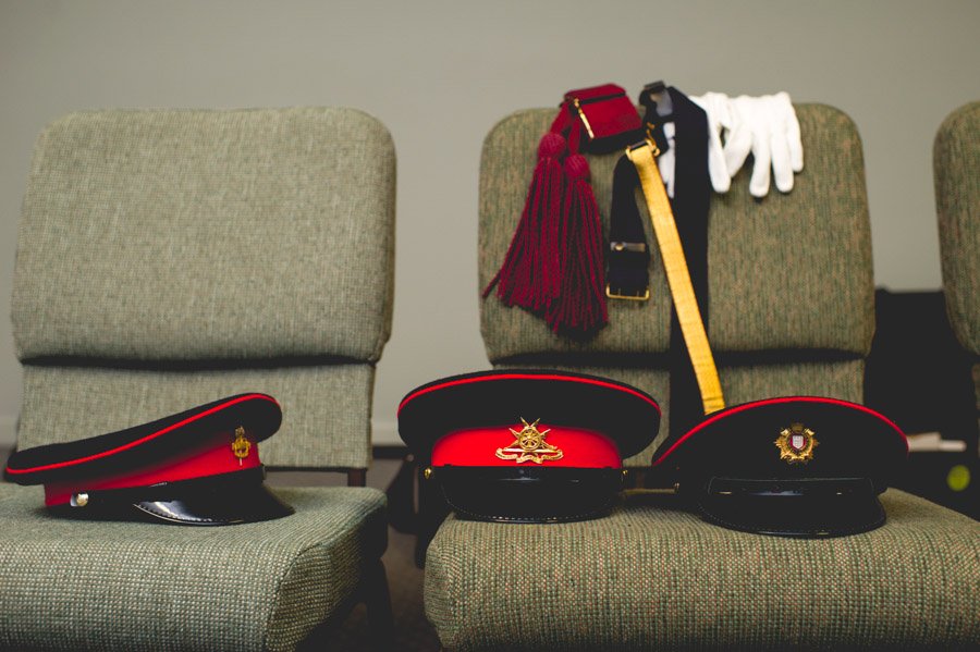 royal military uniform hats at a san antonio wedding