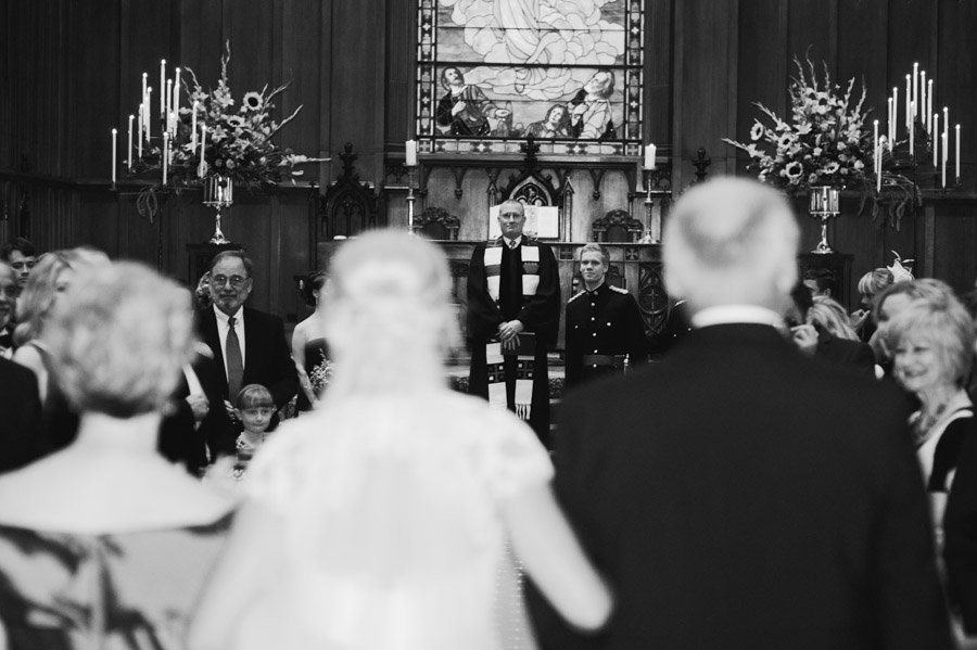 groom sees his bride dressed for the first time during their British first look