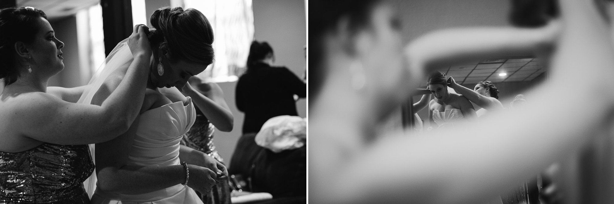 bride getting dressed in black and white