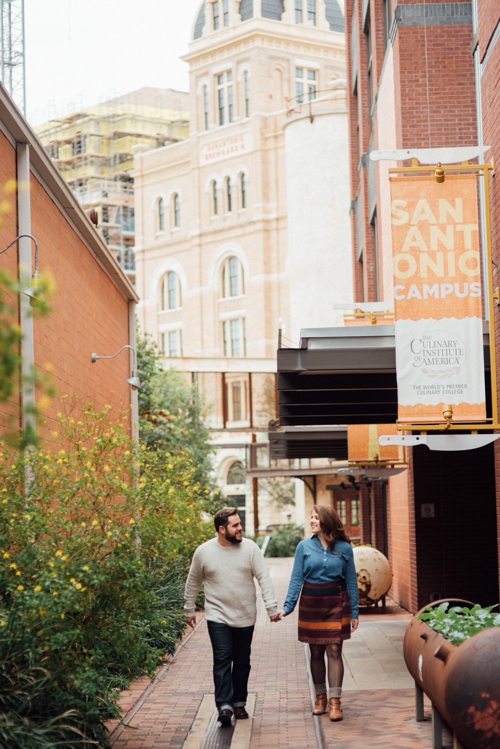 engagement session walking through the pearl brewery in san antonio with hotel emma