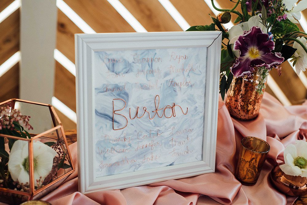 copper wire guestbook with watercolor paper on rose gold fabric