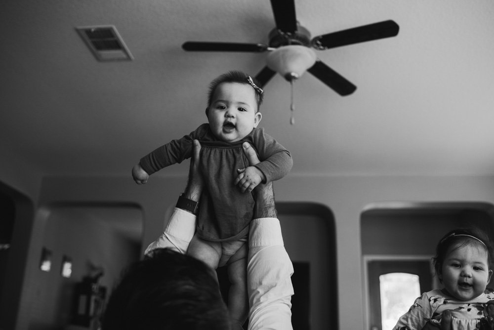black and white family photos taken in the home in austin, austin baby photography, natural light baby photography in austin, austin family photographer, organic and real family photography