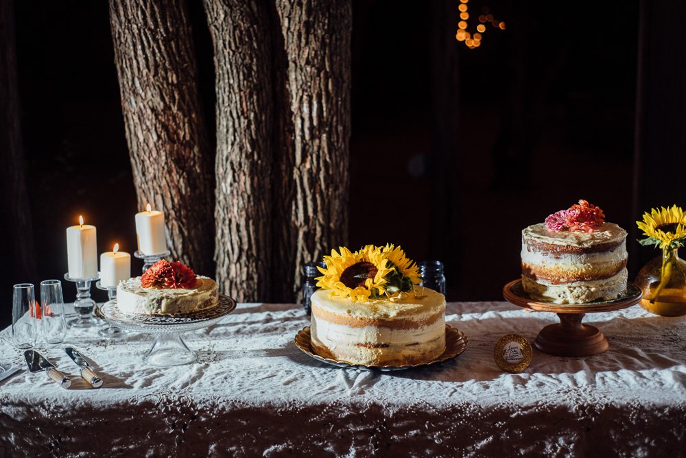 creative cake display at a summer outdoor wedding in austin texas