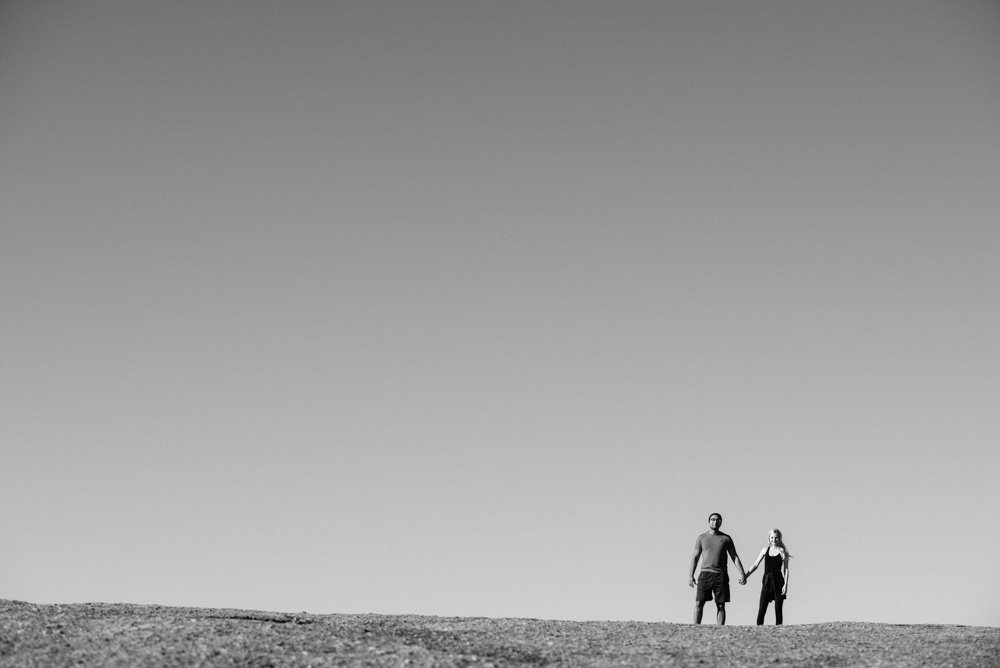 enchanted rock hiking portraits, outdoorsy proposal photographs, nature inspired portraits, sunrise portraits at enchanted rock, pink granite rock structure in austin