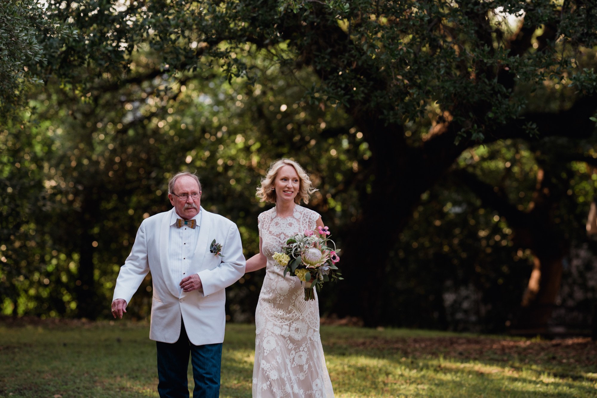 a bride and her dad walk together at a mercury hall wedding in austin texas