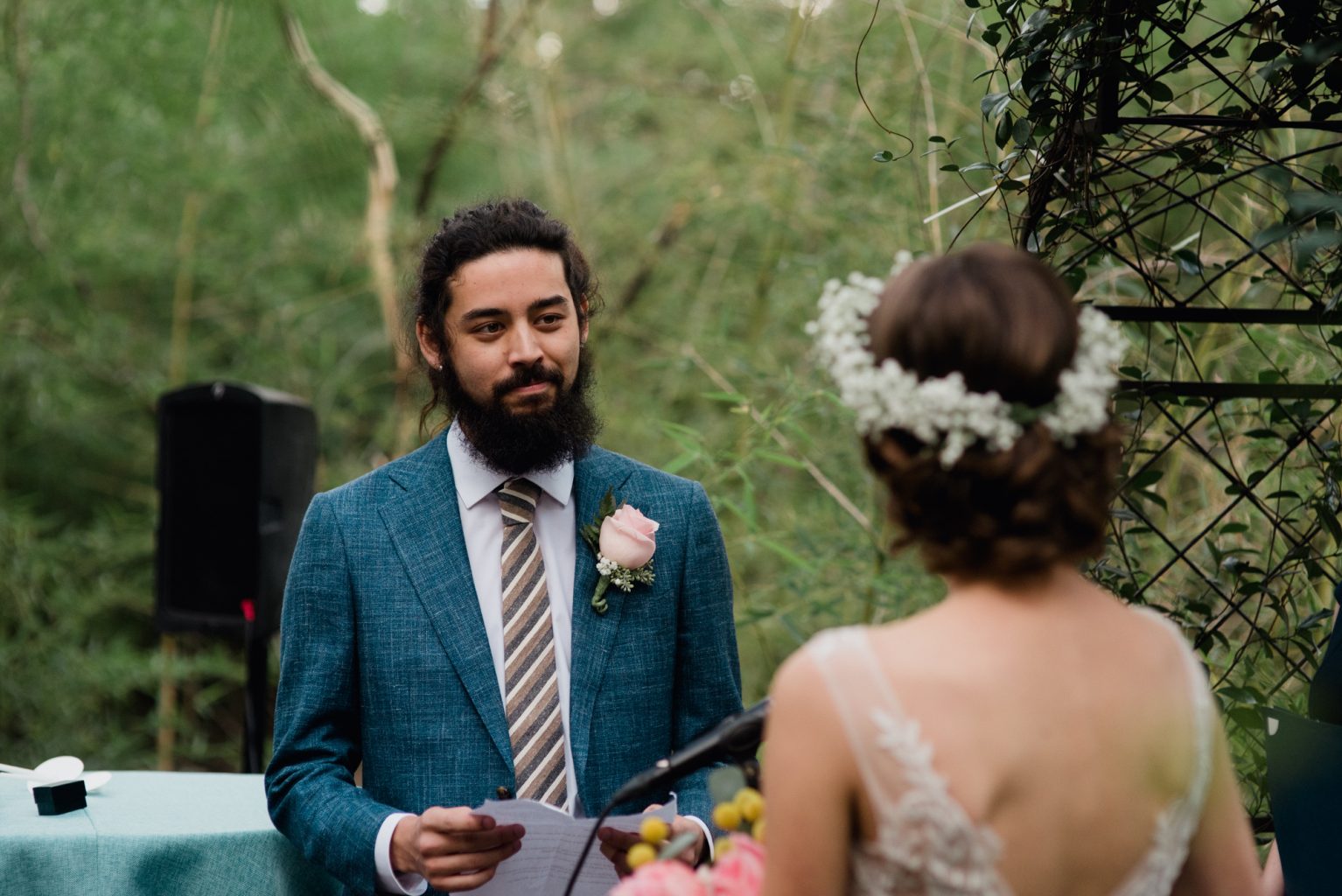 Our groom reads emotional vows during his backyard wedding in Austin Texas