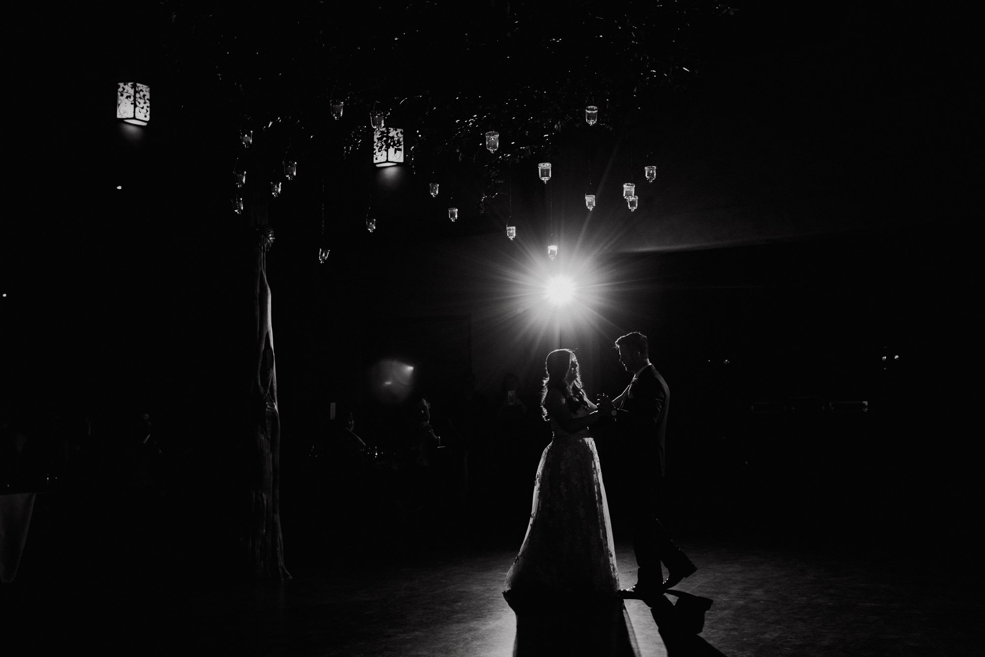 black and white night shot of a couple dancing at their wedding, austin wedding at the barr mansion, spring wedding at the barr mansion in austin, austin wedding photographer