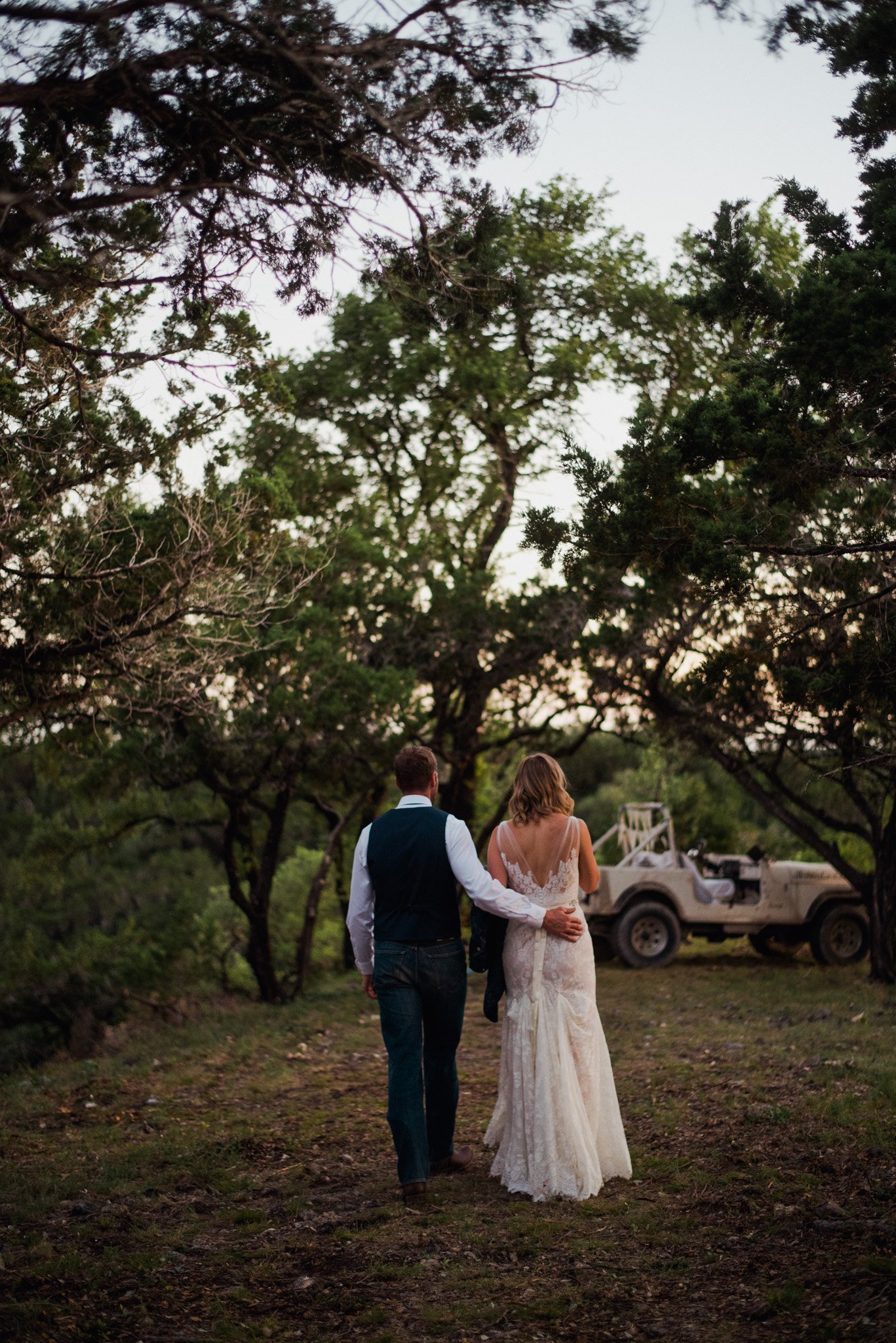 san antonio elopement photographer, ranch elopement photographs, bhldn dress, garner state park wedding, bride and groom walking to their get away jeep, austin hill country elopement