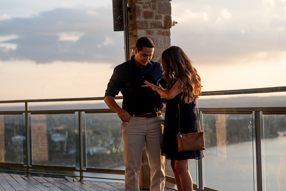 surprise family arrives during an austin proposal at the oasis