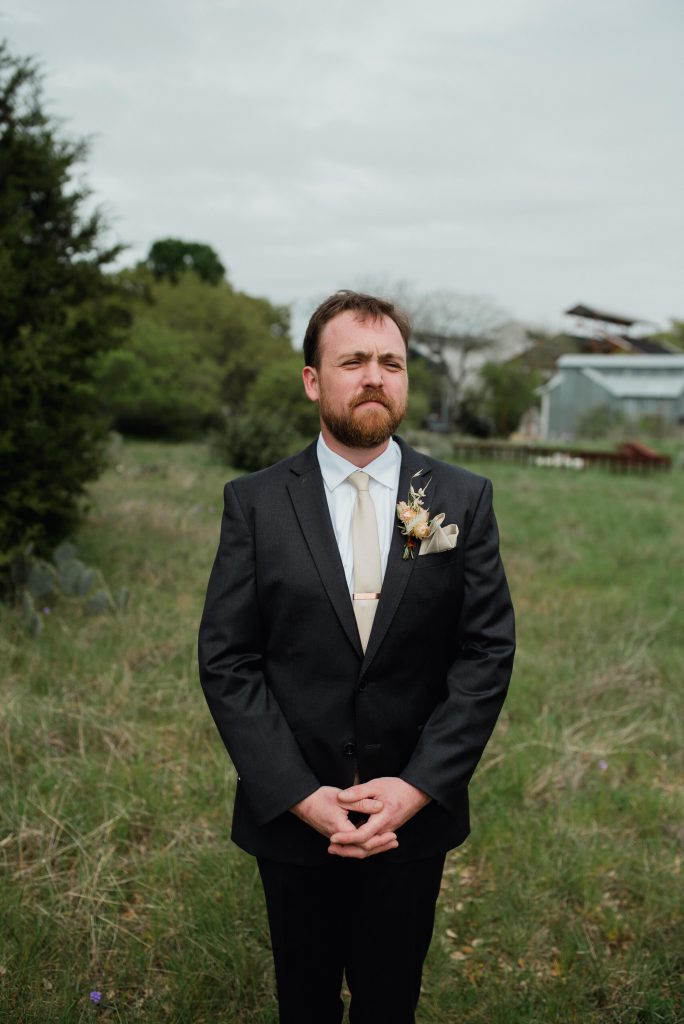 groom waiting for first look