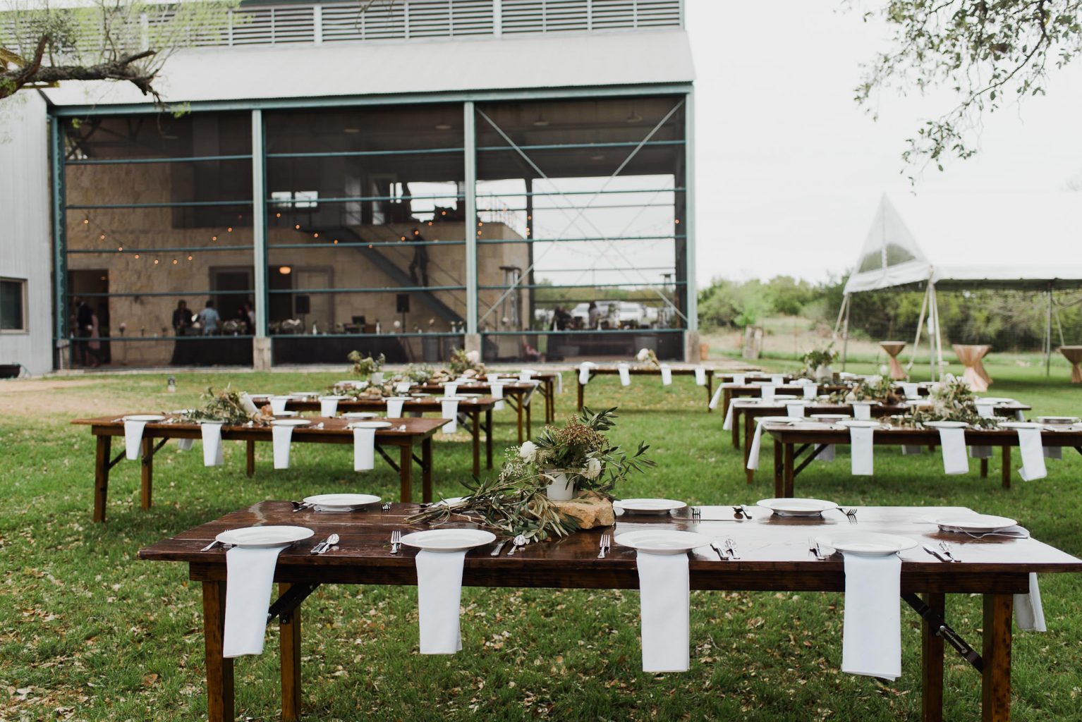 tables set up outside for dinner at the plant at kyle