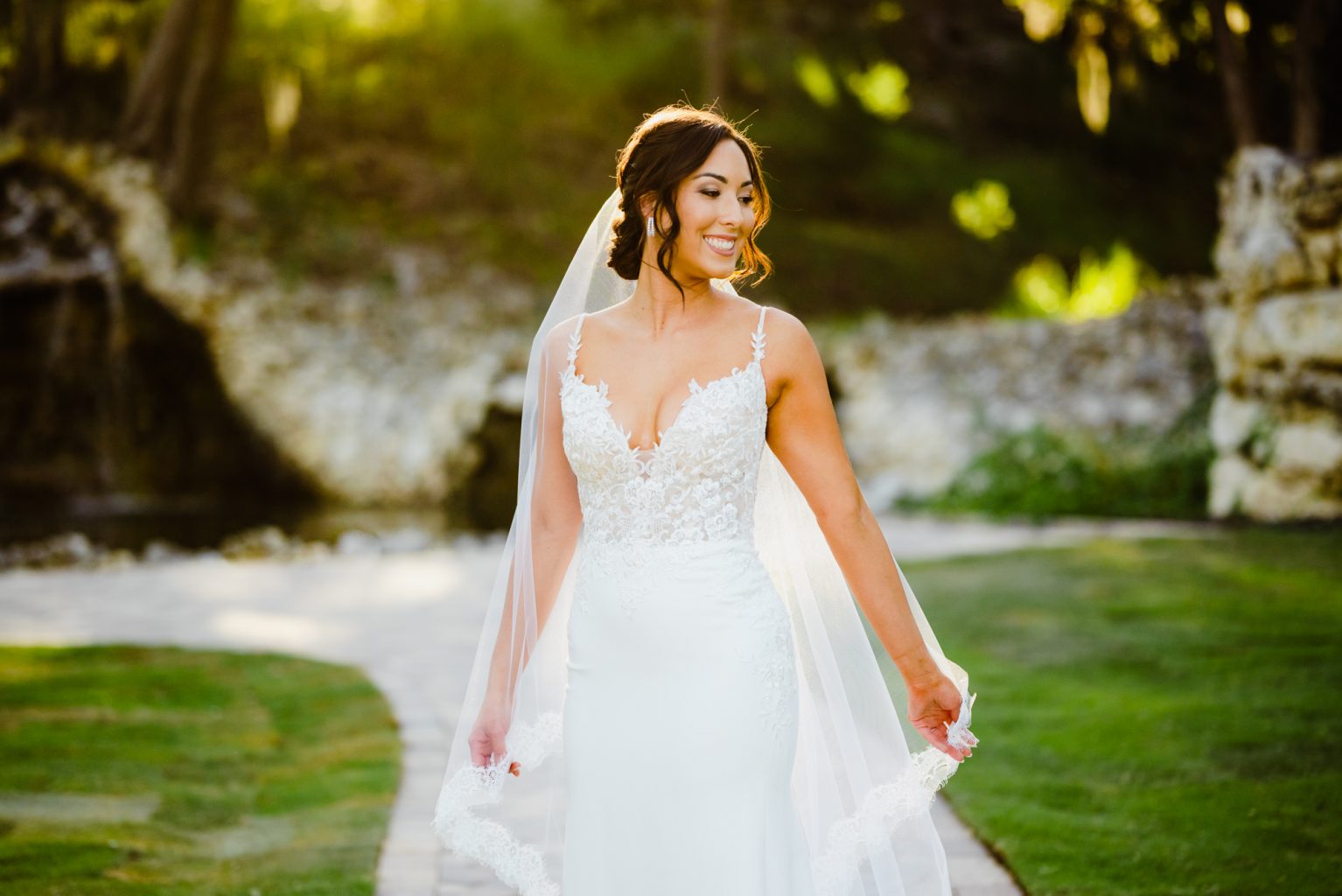 romantic bridal portraits at golden hour, bridal session at Hayes Hollow, bride looks over her shoulder during bridal portraits in nature 
