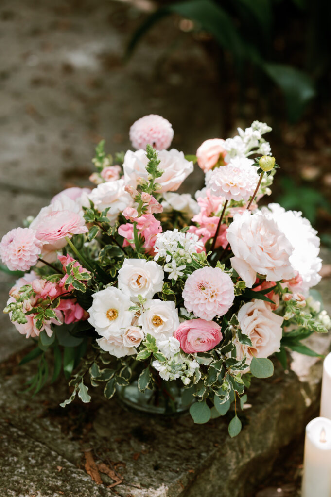 romantic pink floral arrangement detail set up at a proposal at Laguna Gloria in Austin